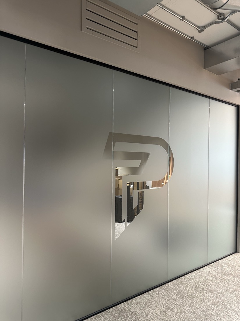The Pubity mark etched on the office glass